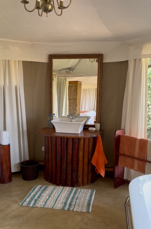 En-suite tent bathroom with twin vanity and bath