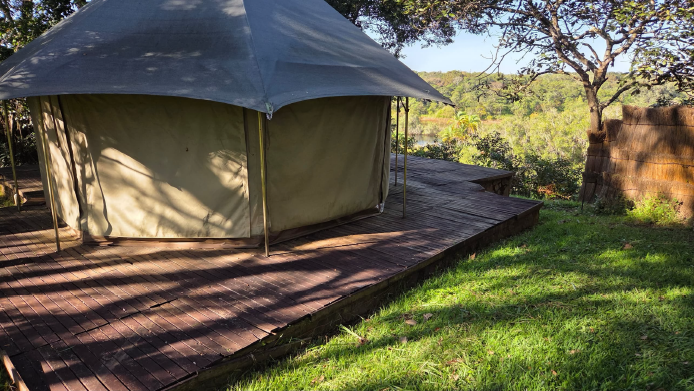 Luxury tent on its private deck overlooking the river valley